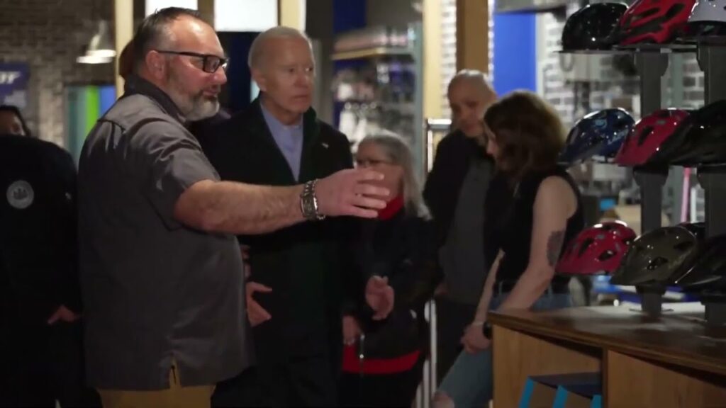 Biden Malfunctions As He Is Guided To His Designated Spot At Bicycle Shop In Pennsylvania